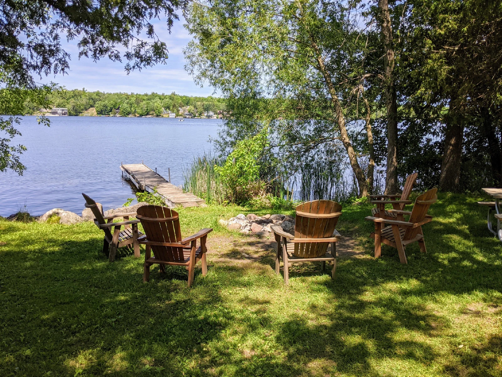 Pigeon-Lake-Resort-Cottage-four-waterfront-campfire-seating-area
